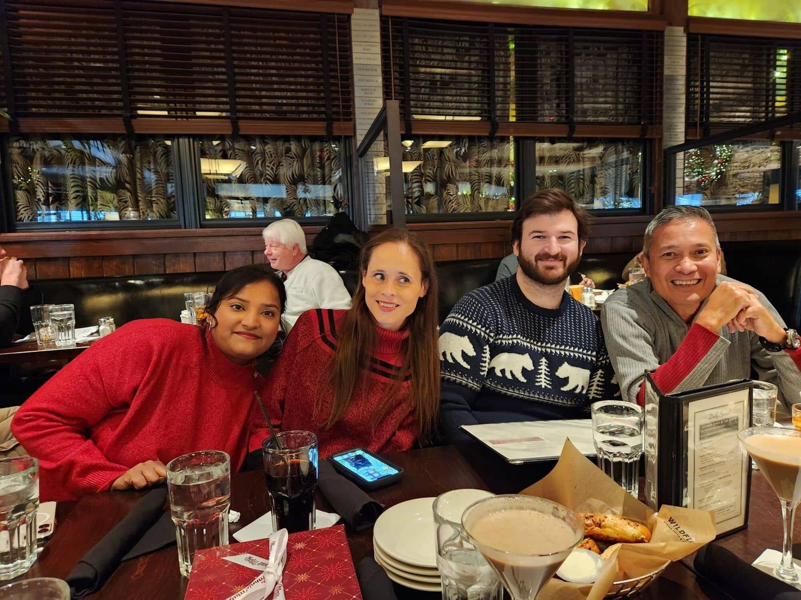 ISG teammates sharing a table at a holiday lunch