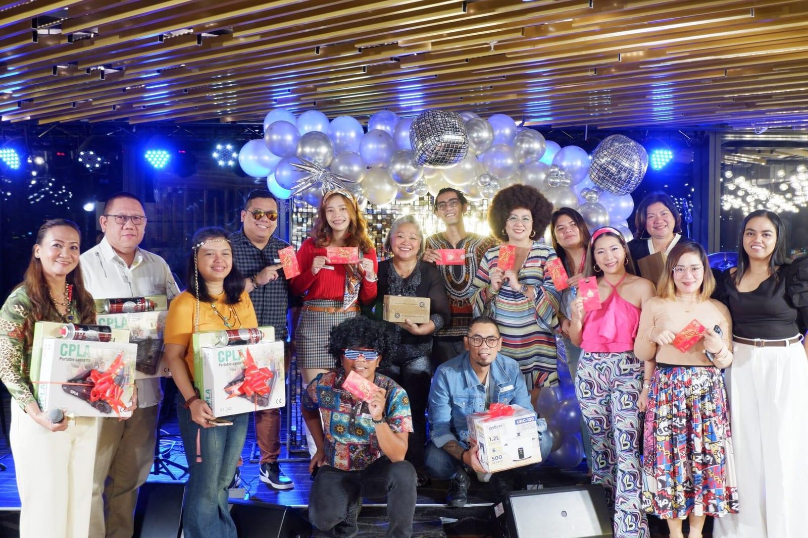 The ISG Manila team with gifts at the year-end party