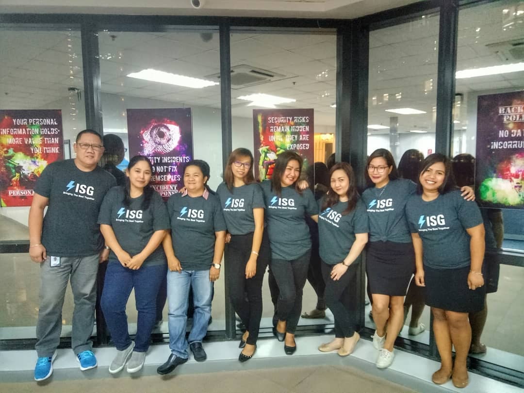 ISG project team in branded shirts at the Manila office